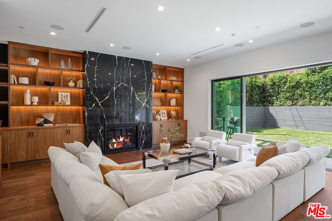Fireplace, Interior, Living room, Marble Walls, Recessed Lighting, Wood Texture Flooring
