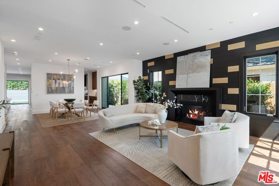 Dining room, Fireplace, Interior, Living room, Pendant Lights, Recessed Lighting, Wood Texture Flooring