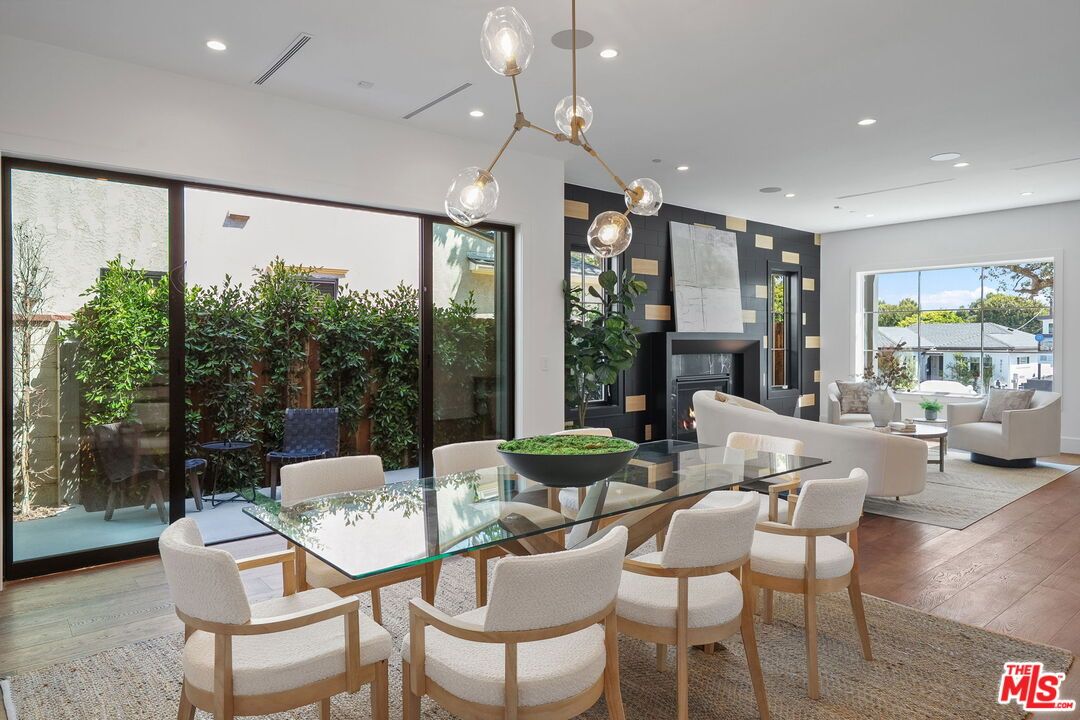 Dining room, Fireplace, Interior, Living room, Pendant Lights, Recessed Lighting, Wood Texture Flooring