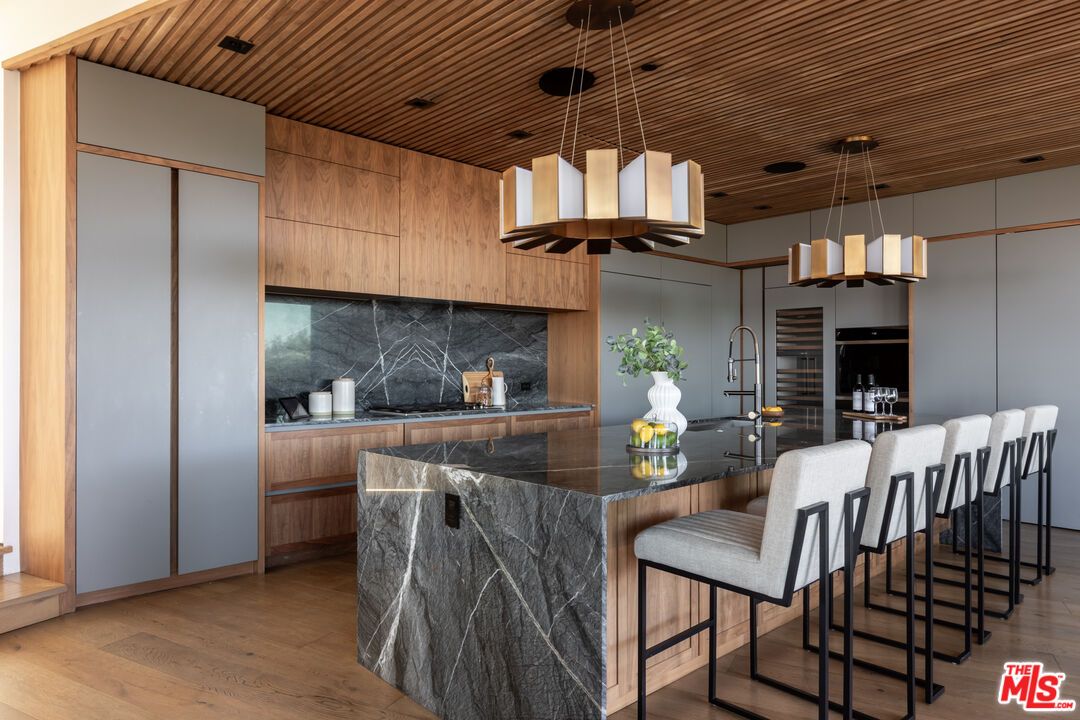 Interior, Kitchen, Marble Walls, Pendant Lights, Recessed Lighting, Wood Texture Flooring