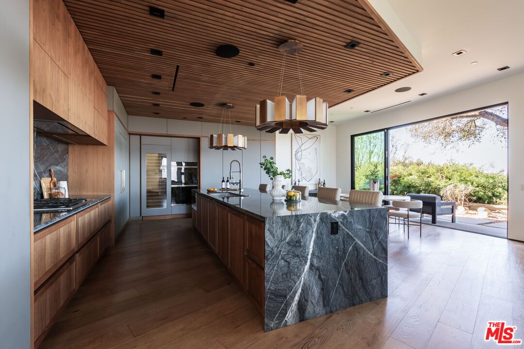 Interior, Kitchen, Marble Walls, Pendant Lights, Recessed Lighting, Stainless Steel Appliances, Wooden Ceilings, Wood Texture Flooring