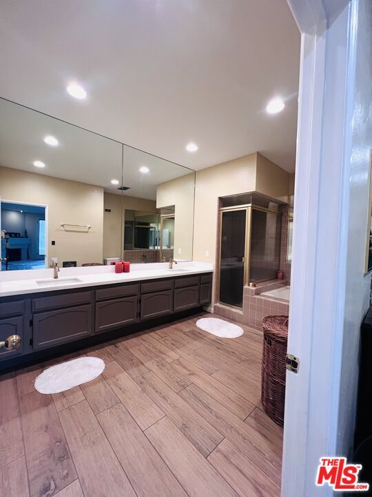 Bathroom, Dual Sink Vanities, Glass Shower, Interior, Recessed Lighting, Wood Texture Flooring