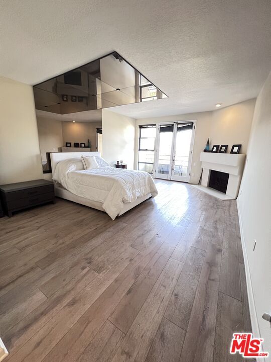 Bedroom, Fireplace, Interior, Recessed Lighting, Wood Texture Flooring