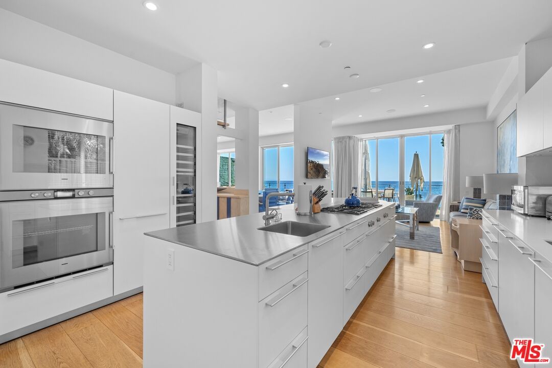 Interior, Kitchen, Recessed Lighting, Stainless Steel Appliances, Water, Wood Texture Flooring