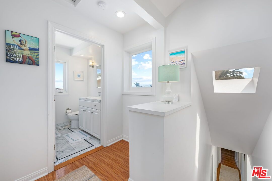 Bathroom, Dual Sink Vanities, Interior, Marble, Recessed Lighting, Wood Texture Flooring