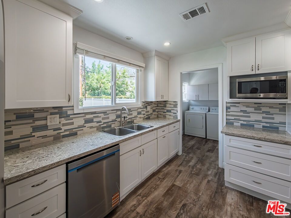 Interior, Kitchen, Recessed Lighting, Washer, Wood Texture Flooring