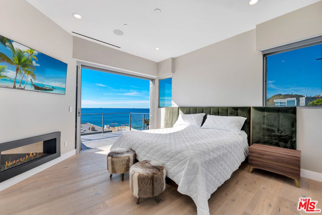 Bedroom, Fireplace, Interior, Recessed Lighting, Water, Wood Texture Flooring