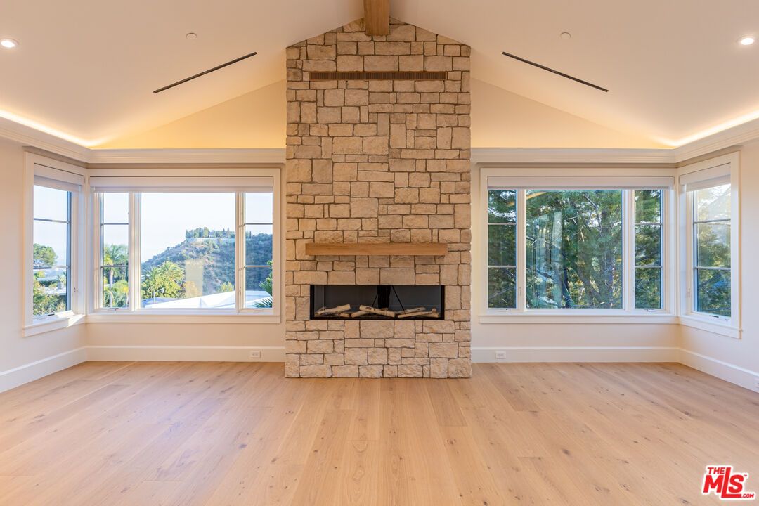 Empty room, Fireplace, Interior, Recessed Lighting, Stone Walls, Wood Texture Flooring
