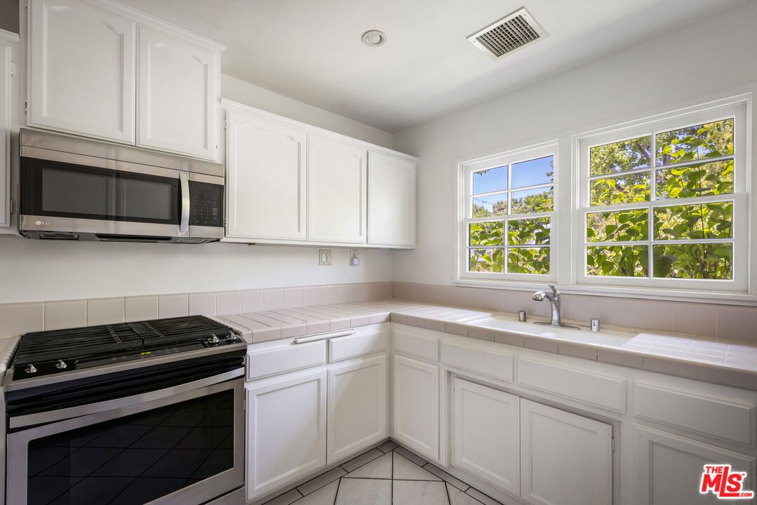 Interior, Kitchen, Recessed Lighting, Tile Countertops