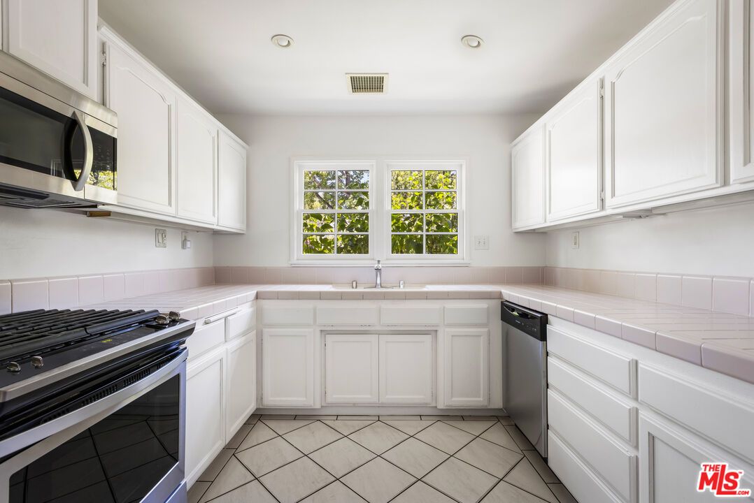 Interior, Kitchen, Recessed Lighting, Stainless Steel Appliances, Tile Countertops