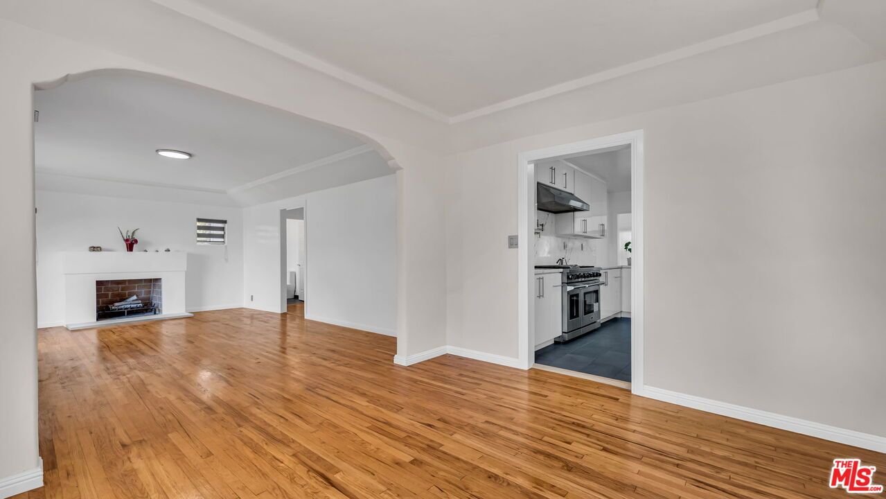Empty room, Fireplace, Interior, Kitchen, Recessed Lighting, Wood Texture Flooring