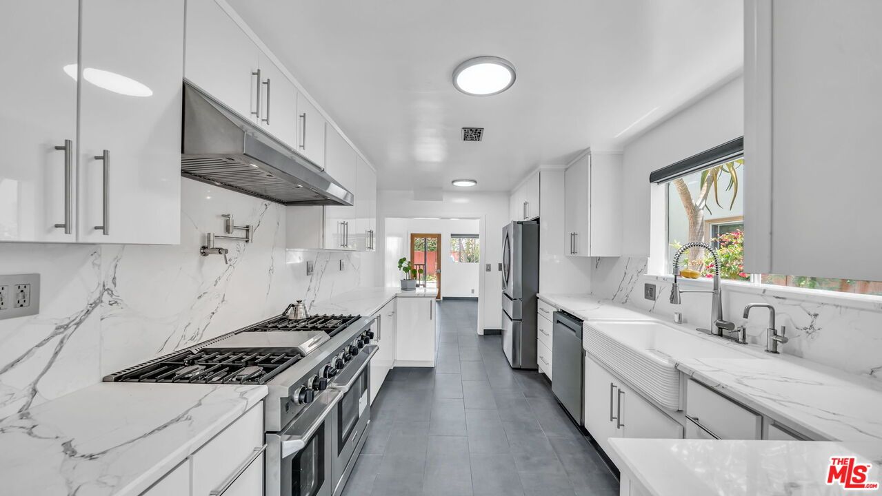 Interior, Kitchen, Marble Walls, Recessed Lighting, Stainless Steel Appliances