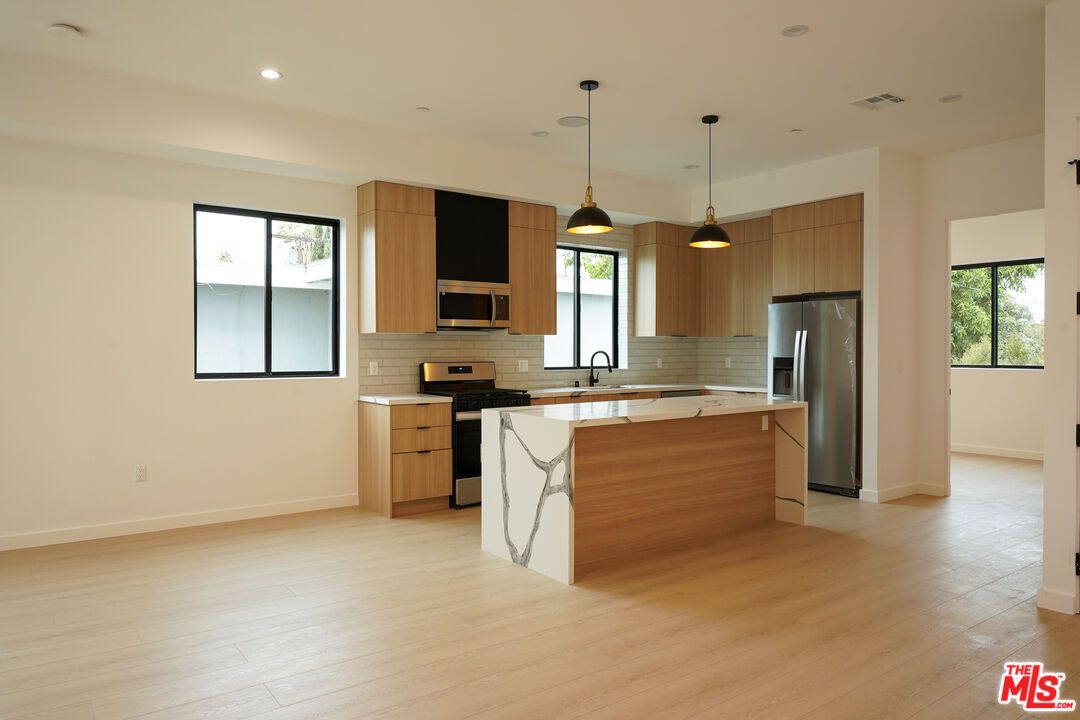 Interior, Kitchen, Pendant Lights, Recessed Lighting, Stainless Steel Appliances, Wood Texture Flooring