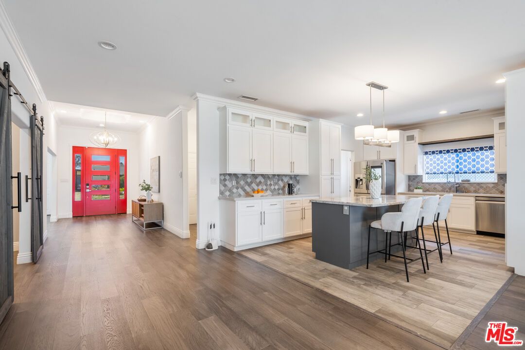 Chandelier, Interior, Kitchen, Pendant Lights, Recessed Lighting, Stainless Steel Appliances, Wood Texture Flooring