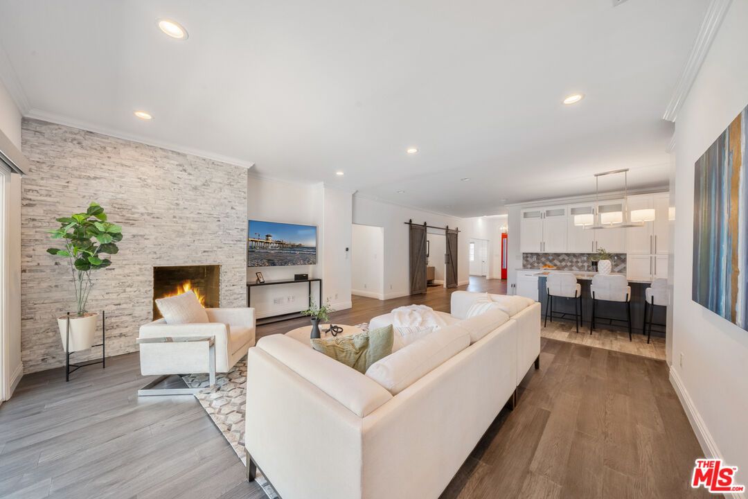 Fireplace, Interior, Kitchen, Living room, Pendant Lights, Recessed Lighting, Stone Walls, Wood Texture Flooring