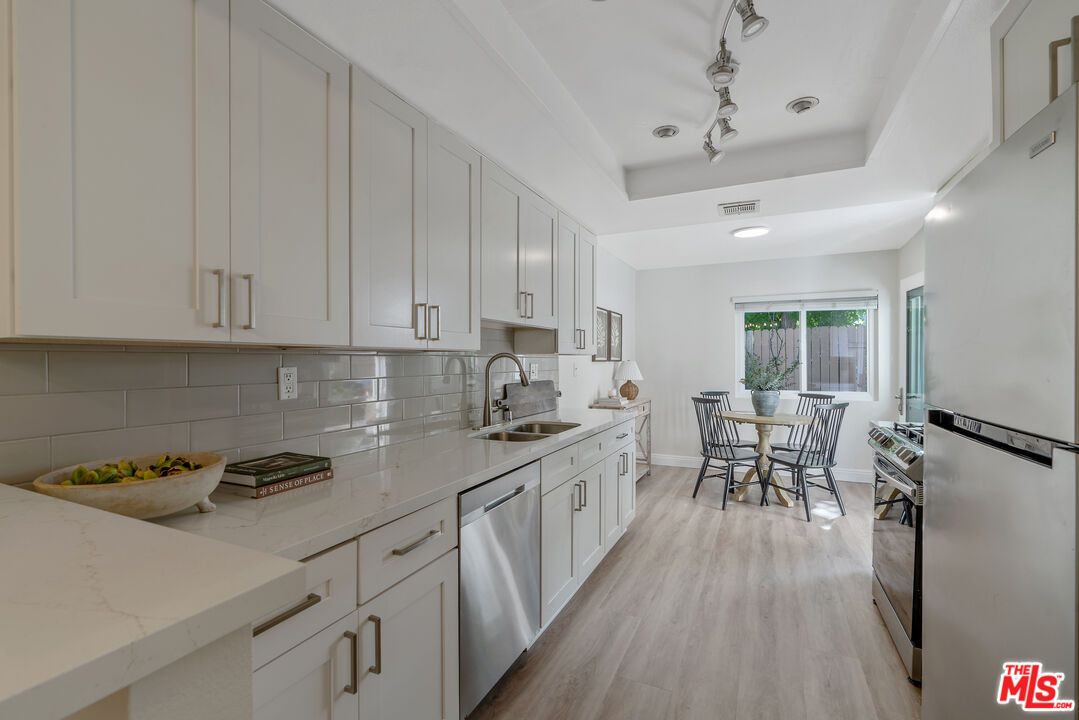 Dining room, Interior, Kitchen, Recessed Lighting, Stainless Steel Appliances, Wood Texture Flooring