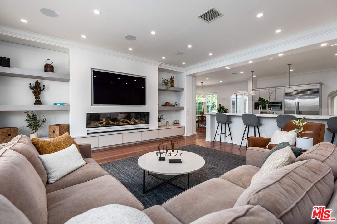 Fireplace, Interior, Kitchen, Living room, Pendant Lights, Recessed Lighting, Stainless Steel Appliances, Wood Texture Flooring