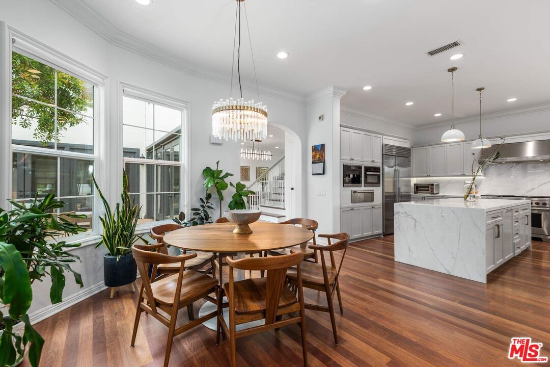 Chandelier, Dining room, Interior, Kitchen, Pendant Lights, Recessed Lighting, Stainless Steel Appliances, Wood Texture Flooring