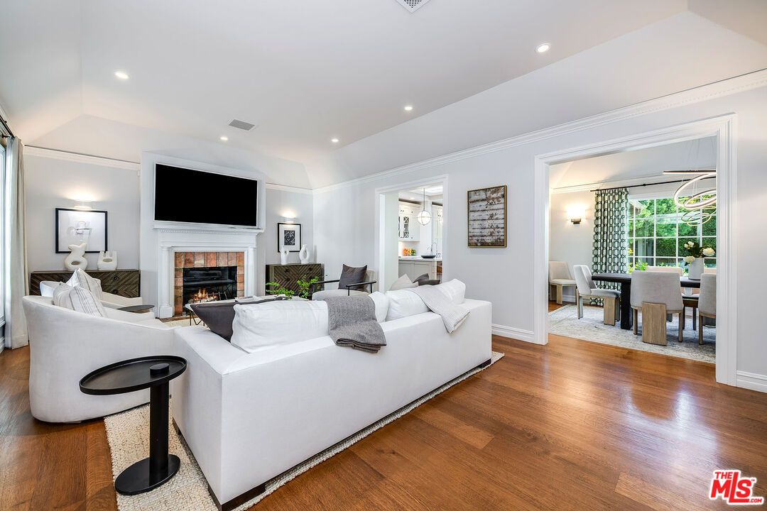Dining room, Fireplace, Interior, Living room, Recessed Lighting, Wood Texture Flooring
