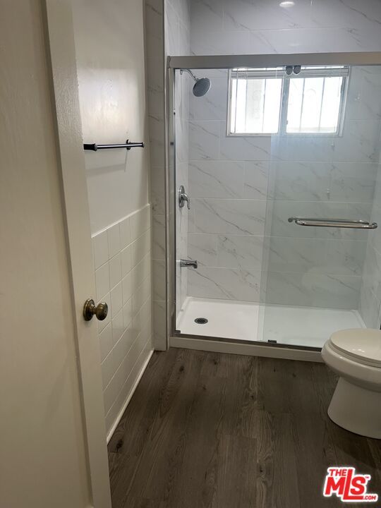 Bathroom, Glass Shower, Interior, Marble Walls, Wood Texture Flooring