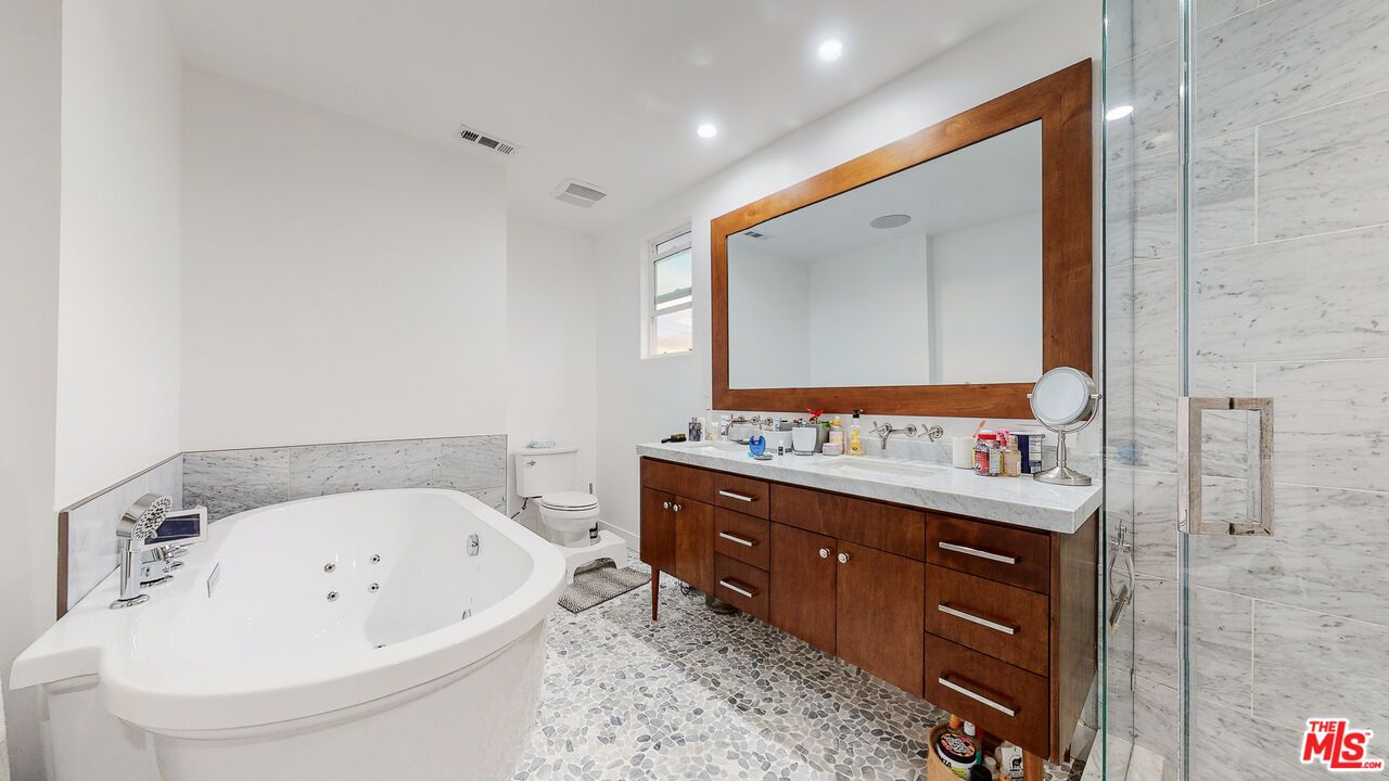 Bathroom, Dual Sink Vanities, Free Standing Baths, Glass Shower, Interior, Marble Walls, Recessed Lighting
