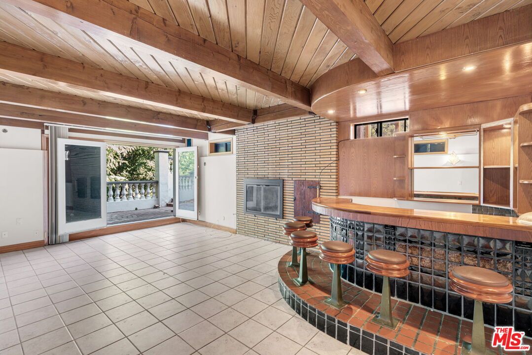 Empty room, Fireplace, Interior, Recessed Lighting, Stone Walls, Wooden Beams, Wooden Ceilings