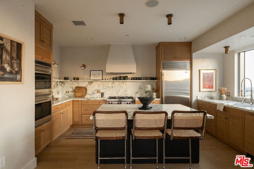 Interior, Kitchen, Marble Walls, Recessed Lighting, Stainless Steel Appliances, Wood Texture Flooring