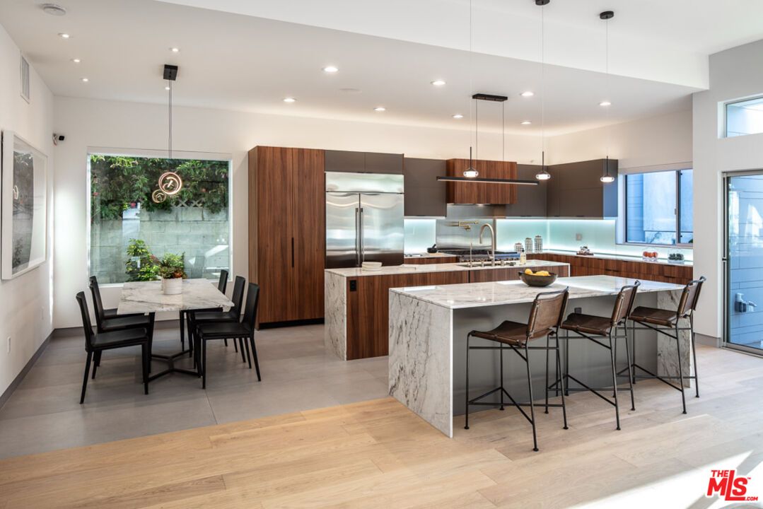 Dining room, Interior, Kitchen, Pendant Lights, Recessed Lighting, Stainless Steel Appliances, Wood Texture Flooring
