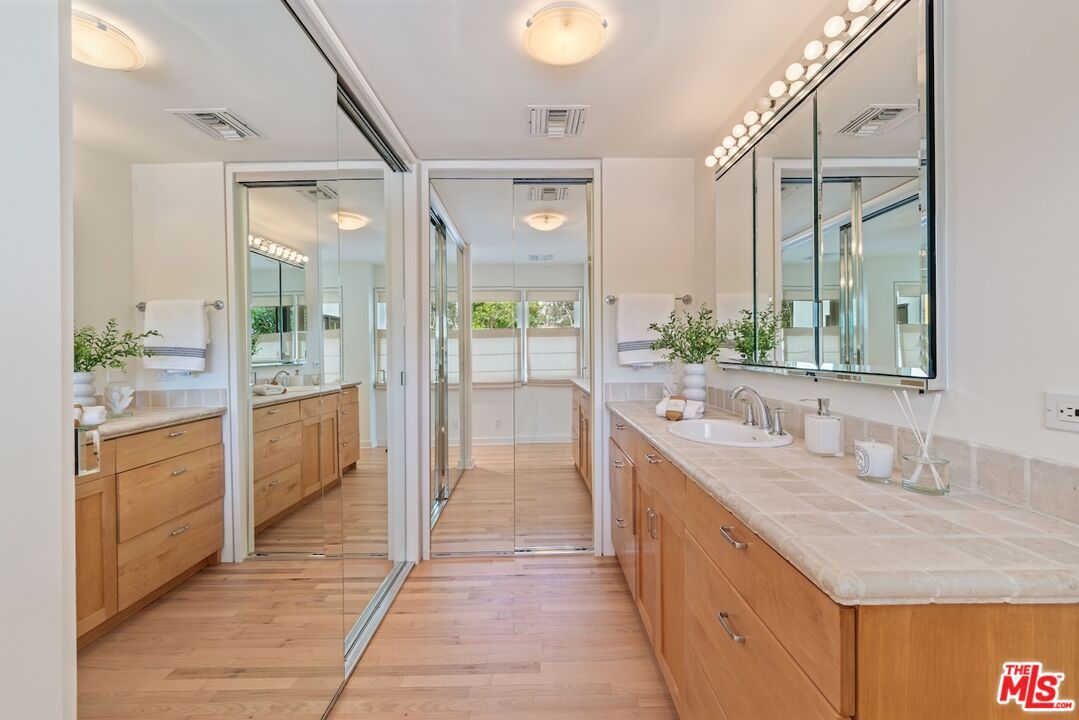 Bathroom, Dual Sink Vanities, Glass Shower, Interior, Tile Countertops, Wood Texture Flooring