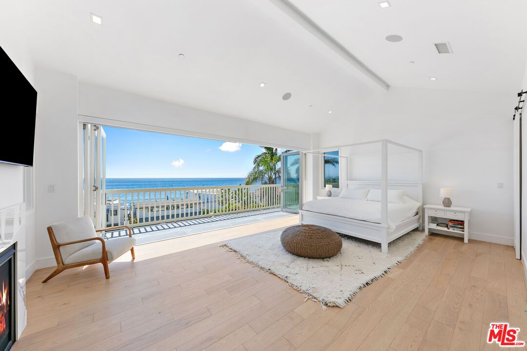 Bedroom, Fireplace, Interior, Recessed Lighting, Water, Wood Texture Flooring