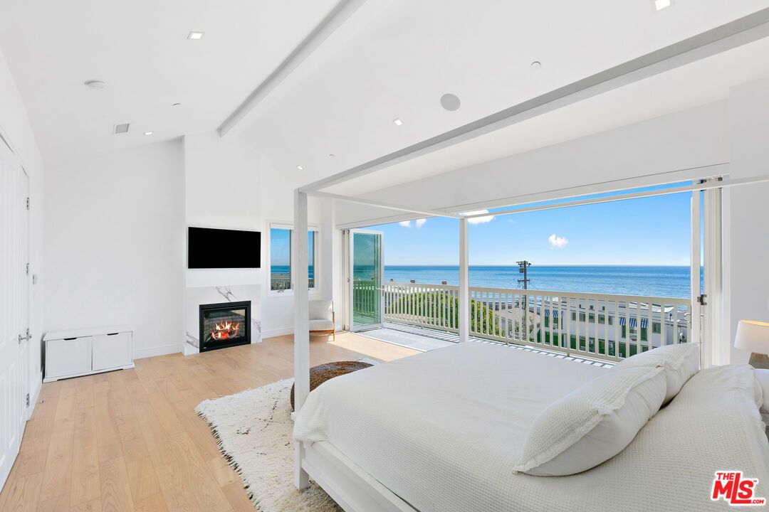 Bedroom, Fireplace, Interior, Recessed Lighting, Water, Wood Texture Flooring