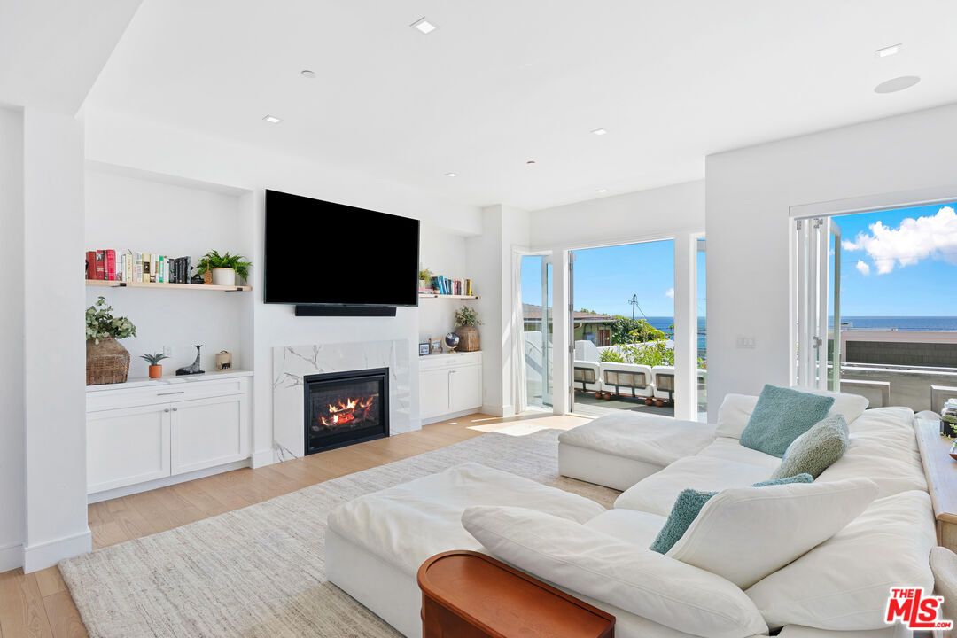 Fireplace, Interior, Living room, Recessed Lighting, Water, Wood Texture Flooring