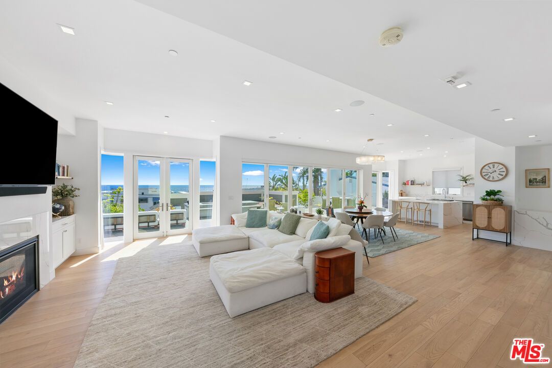 Chandelier, Dining room, Fireplace, Interior, Kitchen, Living room, Pendant Lights, Recessed Lighting, Water, Wood Texture Flooring