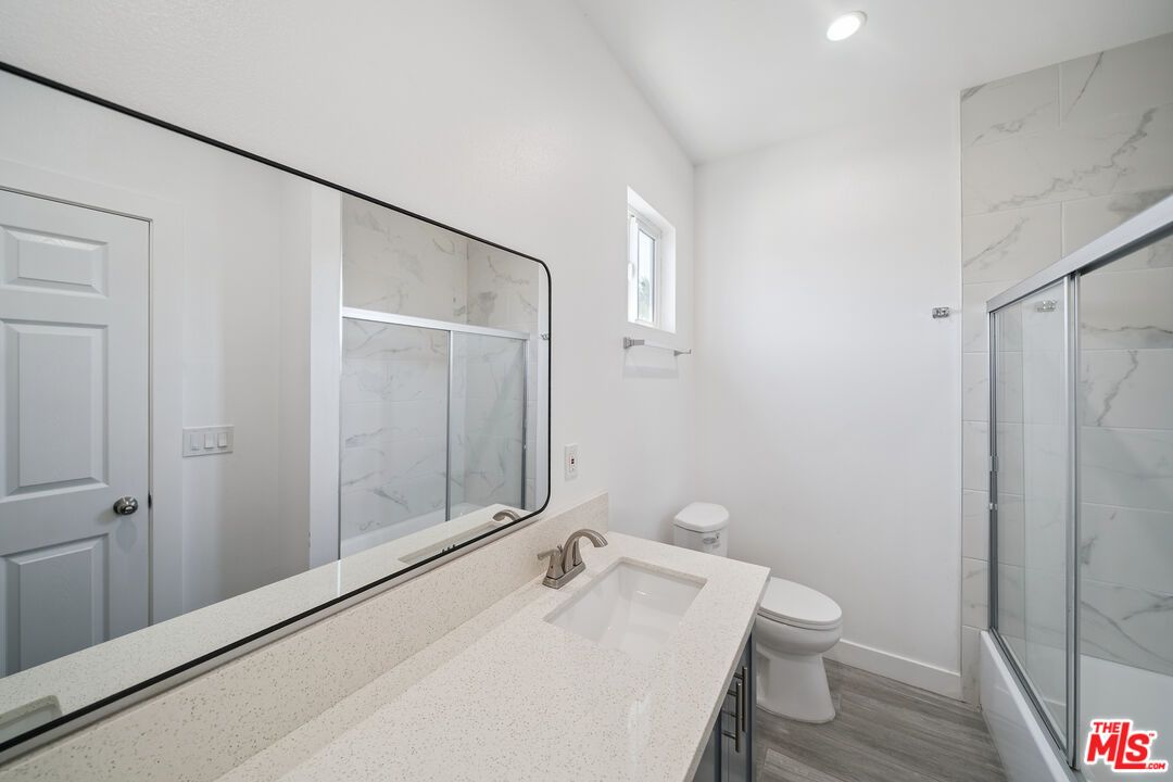 Bathroom, Glass Shower, Interior, Marble Walls, Recessed Lighting, Wood Texture Flooring