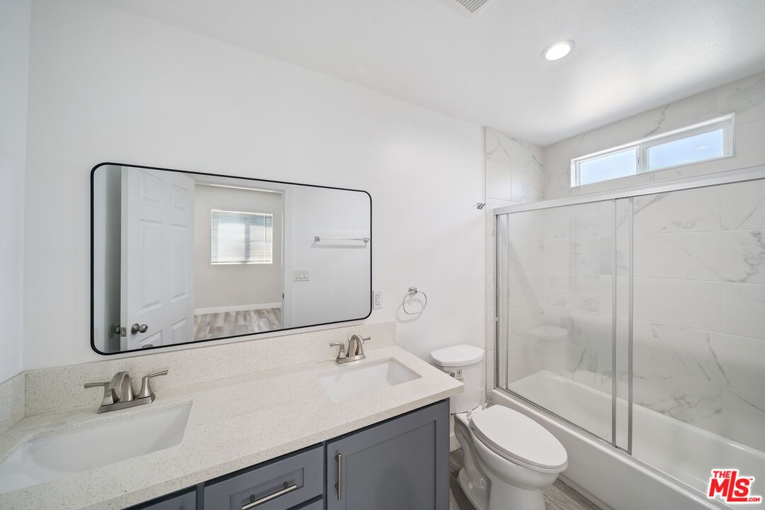 Bathroom, Dual Sink Vanities, Glass Shower, Interior, Marble Walls, Recessed Lighting