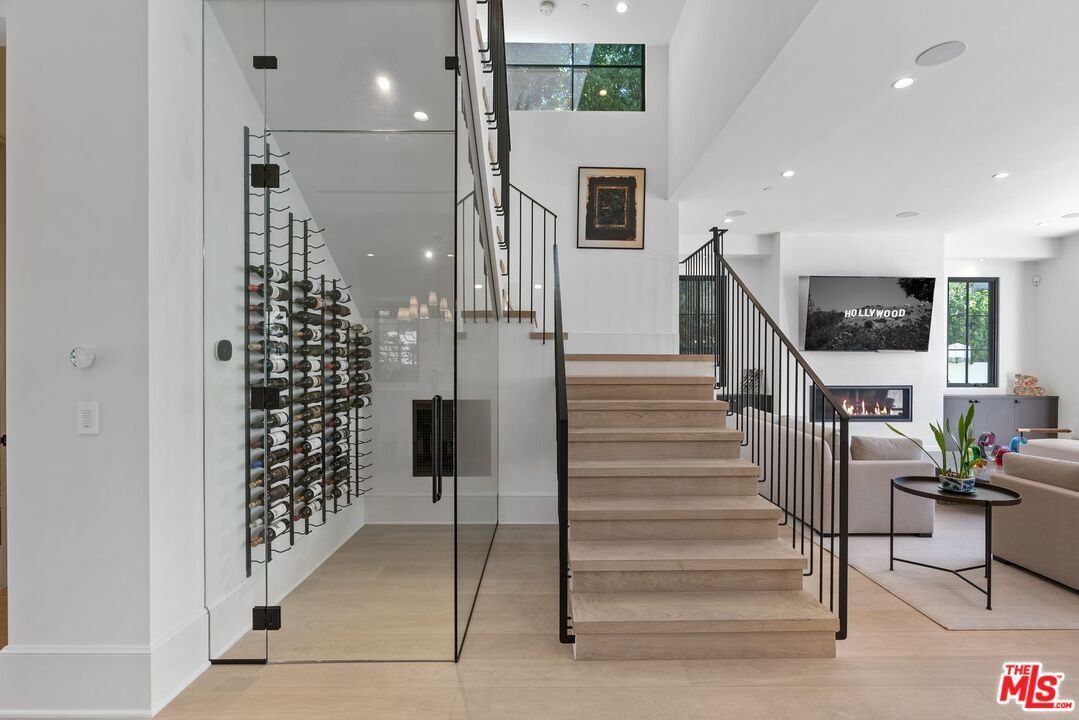 Fireplace, Interior, Living room, Pendant Lights, Recessed Lighting, Wine Storage, Wood Texture Flooring