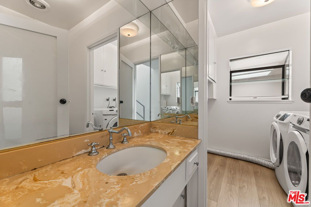 Bathroom, Dual Sink Vanities, Interior, Washer, Wood Texture Flooring