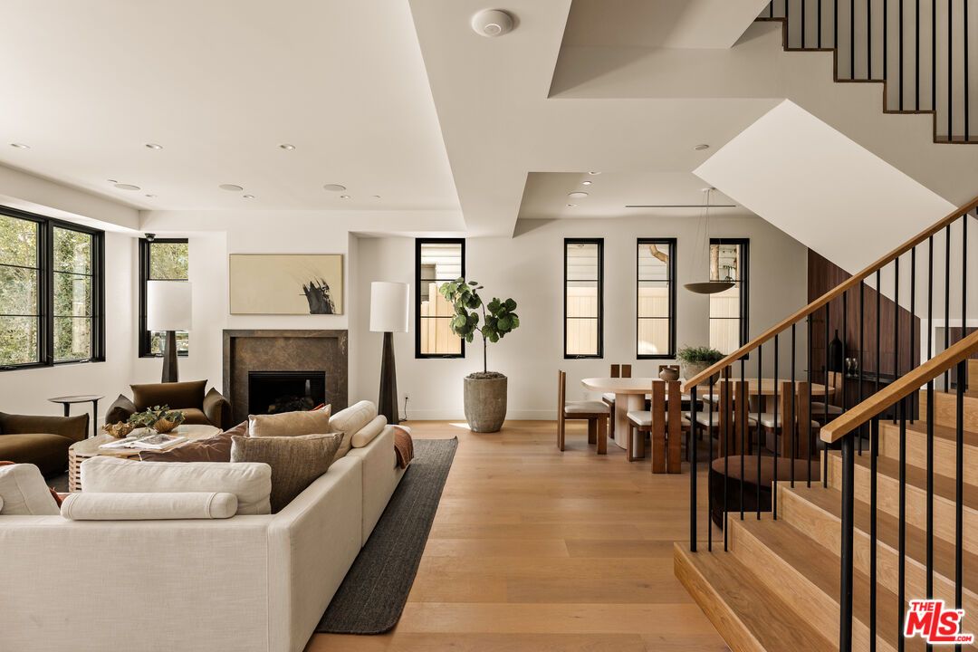 Dining room, Fireplace, Interior, Living room, Pendant Lights, Recessed Lighting, Wood Texture Flooring