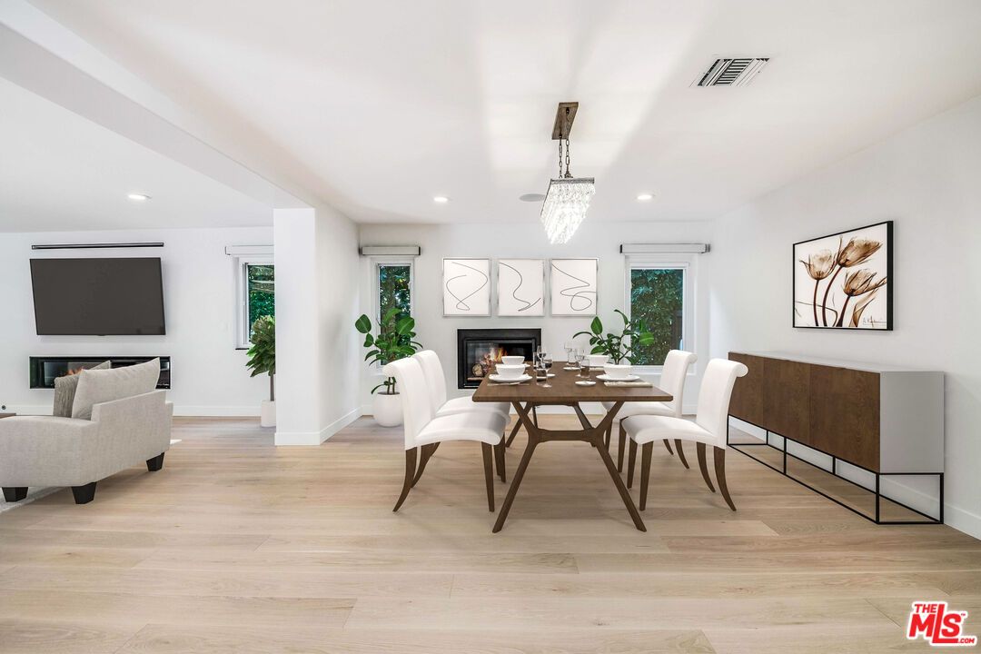 Chandelier, Dining room, Fireplace, Interior, Living room, Pendant Lights, Recessed Lighting, Wood Texture Flooring