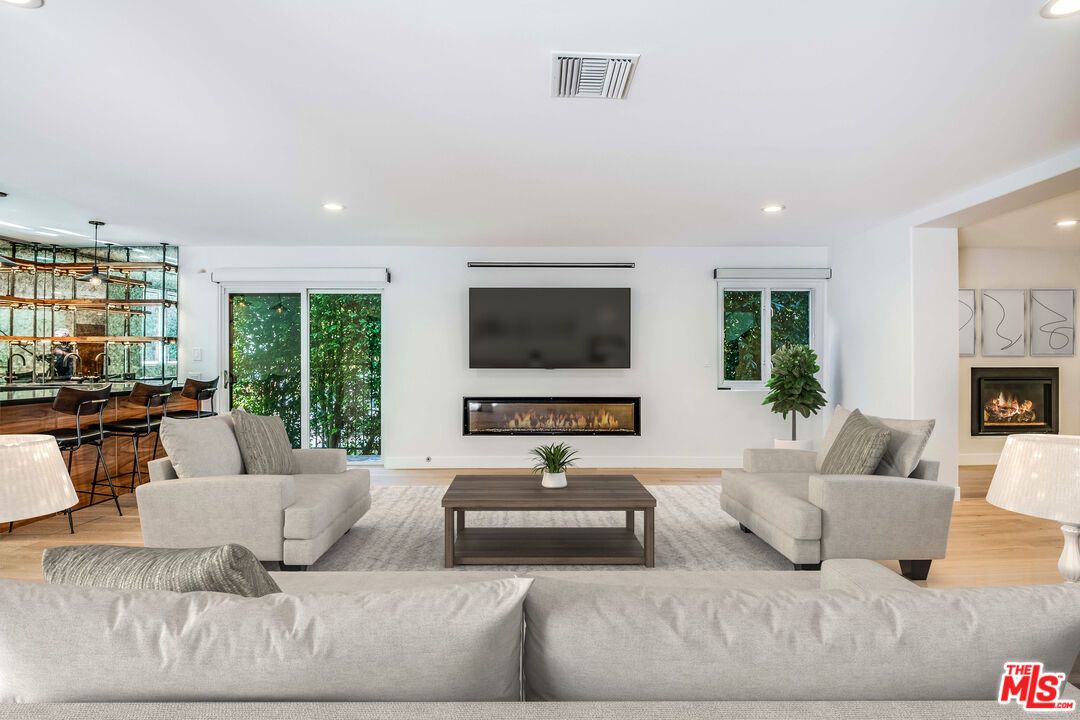 Dining room, Fireplace, Interior, Living room, Pendant Lights, Recessed Lighting, Wood Texture Flooring