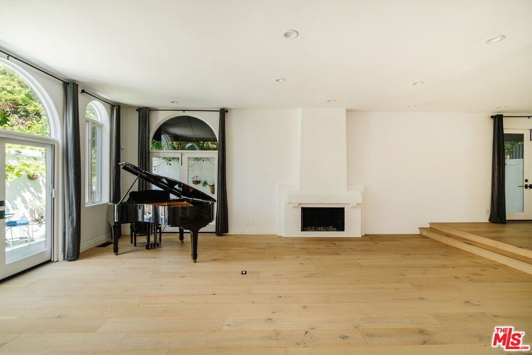 Fireplace, Interior, Piano, Recessed Lighting, Wood Texture Flooring
