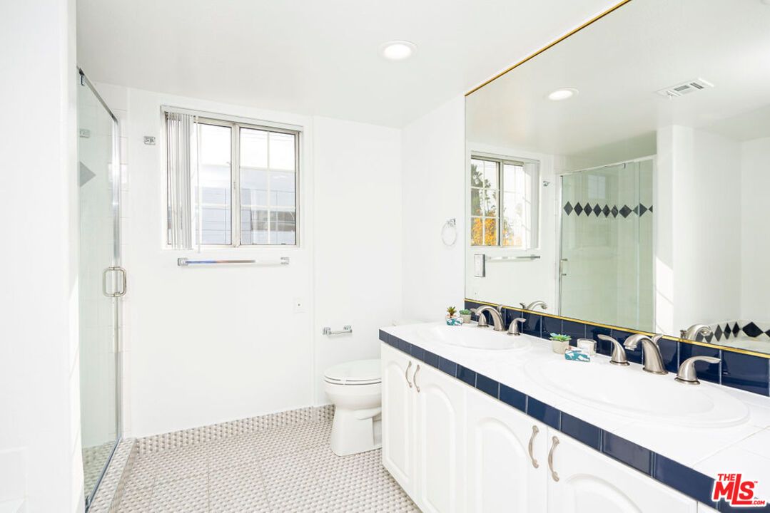 Bathroom, Dual Sink Vanities, Glass Shower, Interior, Recessed Lighting, Tile Countertops