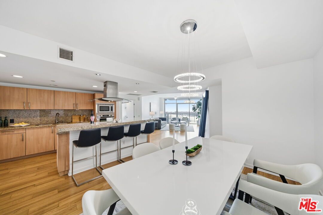 Dining room, Interior, Kitchen, Pendant Lights, Recessed Lighting, Stainless Steel Appliances, Wood Texture Flooring