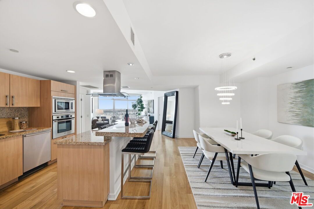 Dining room, Interior, Kitchen, Pendant Lights, Recessed Lighting, Stainless Steel Appliances, Wood Texture Flooring