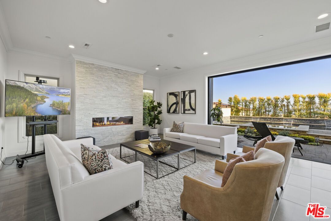 Fireplace, Interior, Living room, Recessed Lighting, Stone Walls, Wood Texture Flooring