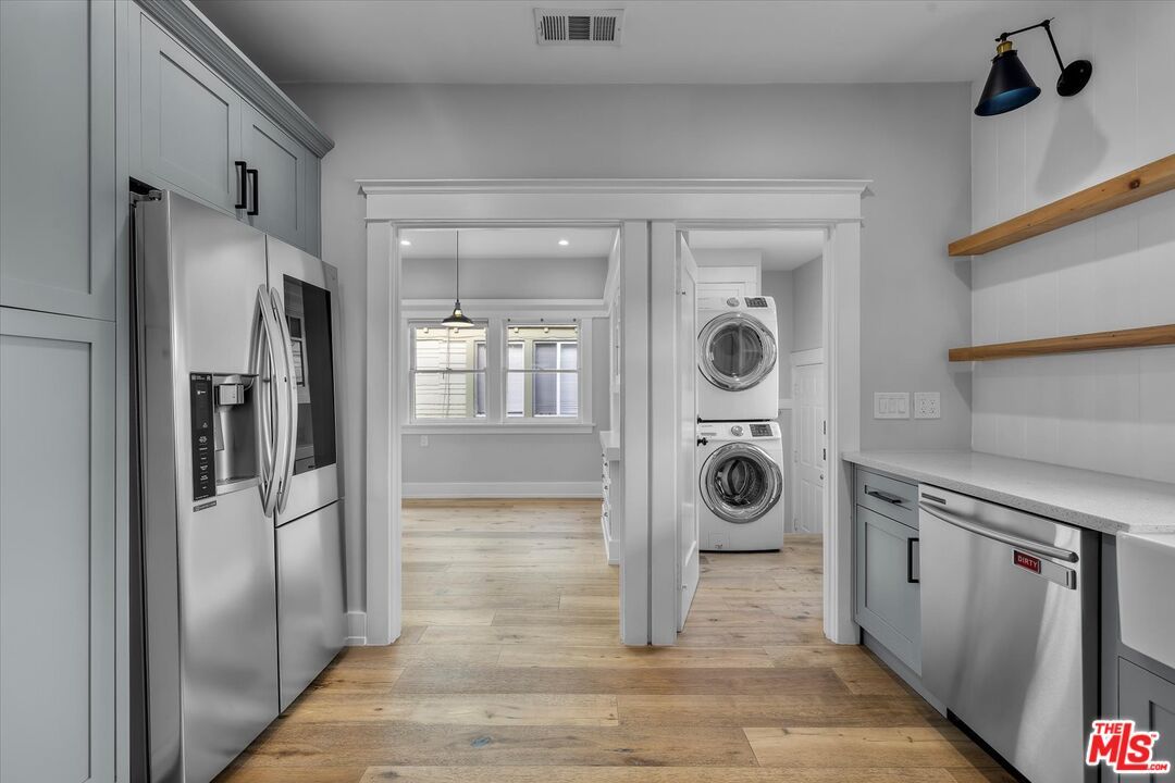 Interior, Kitchen, Recessed Lighting, Stainless Steel Appliances, Washer, Wood Texture Flooring