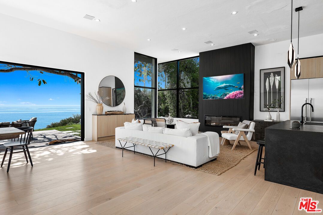 Dining room, Fireplace, Interior, Kitchen, Living room, Pendant Lights, Recessed Lighting, Water, Wood Texture Flooring