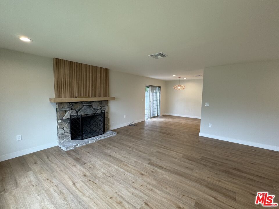 Empty room, Fireplace, Interior, Pendant Lights, Recessed Lighting, Wood Texture Flooring