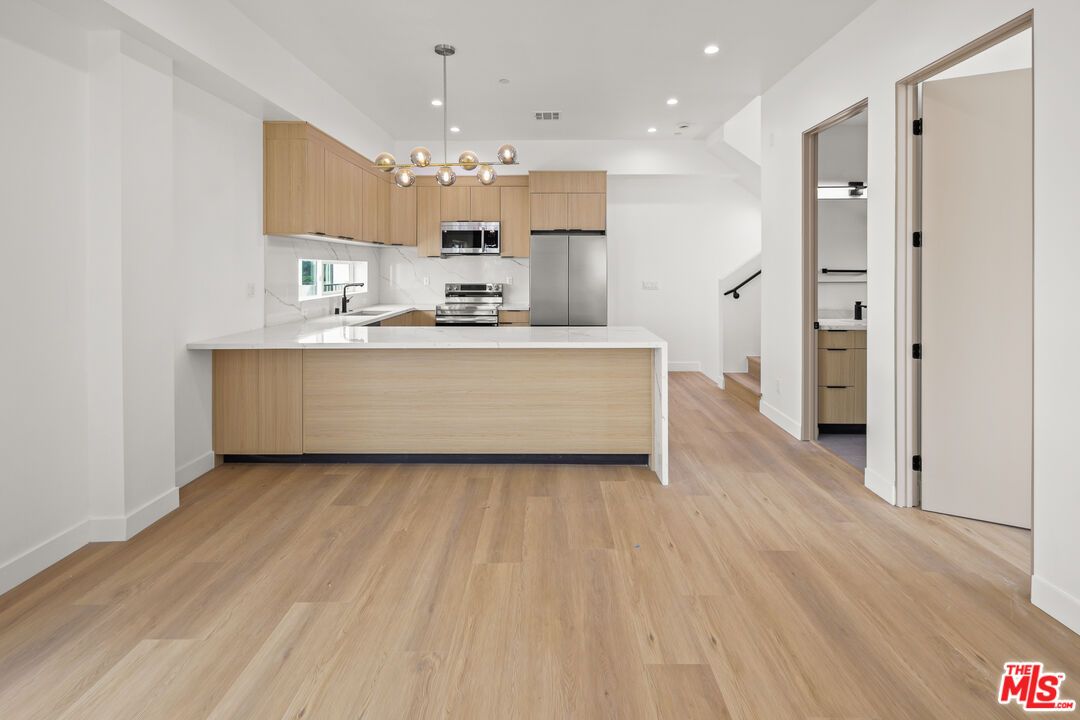 Interior, Kitchen, Pendant Lights, Recessed Lighting, Stainless Steel Appliances, Wood Texture Flooring
