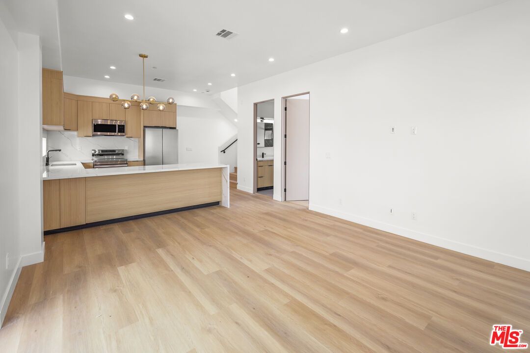 Interior, Kitchen, Pendant Lights, Recessed Lighting, Stainless Steel Appliances, Wood Texture Flooring